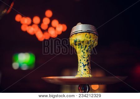 Preparing The Shisha, Aka Nargile Or Hookah At A Restaurant By Placing The Charcoals On Top.