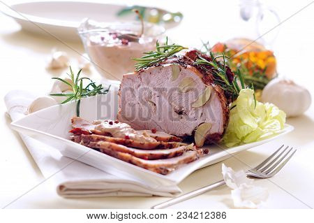 Roast Ham Stuffed With Garlic With Tuna Sauce.
