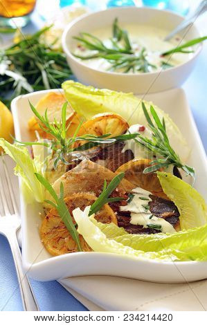 Roasted Fish With Lemon And Tarragon Sauce.