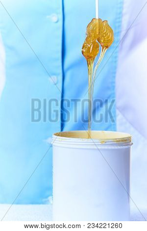Lollipop In A Stretchy Clear Golden Luminous Sugaring Paste For Depilation