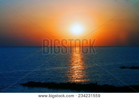 Beautiful Sunset On The Sea With Shallow Waves In Summer Hot Evening Poster Background