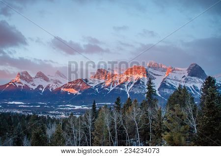 Panoramatic View Of Mountain Range Above Town Of Canmore In Canada, Sunrise View Of Canadian Rockies