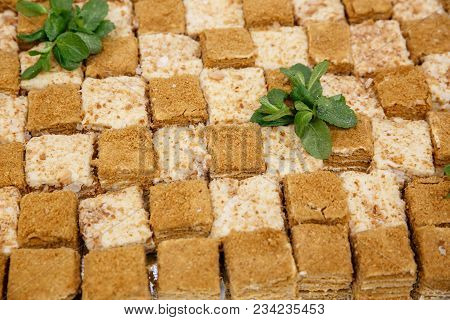 A Lot Of Pieces Of Fresh Honey Cakes, On A Iron Tray. Event Catering Service, Top View