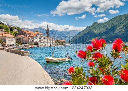 Scenic Panorama View Of The Historic Town Of Perast At Famous Bay Of Kotor With Blooming Flowers On 