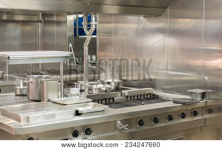 Food Being Cooked In Commercial Stainless Steel Kitchen In Restaurant