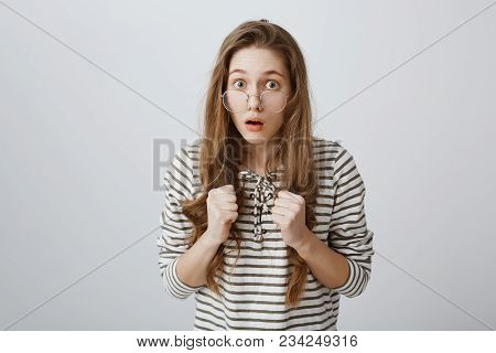 Timid Girl Tries To Stand For Herself. Portrait Of Nervous Smart Young Female Student In Glasses, Ho