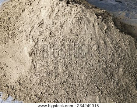 A Pile Of Sand At A Construction Site. Construction Materials.