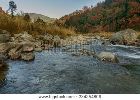 Beautiful Reshi River Water Flowing Through Stones And Rocks At Dawn, Sikkim, India. Reshi Is One Of