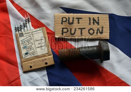 ILLUSTRATIVE EDITORIAL. The scandal about poisoning of former spy Sergei Skripal. Concept. British Flag background.March 24, 2018 in Kiev,Ukraine