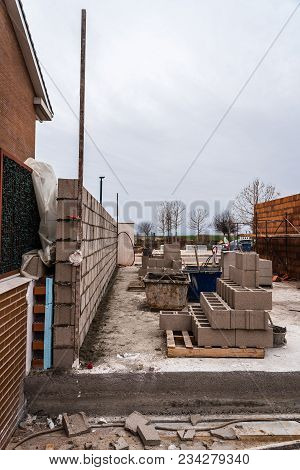 Works Of Construction Of Reinforced Concrete Block Wall With Insulation.