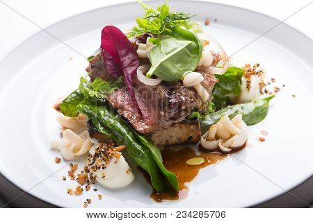 Prepared Roastbeef Served With Vegetables And Herbs On A Bread