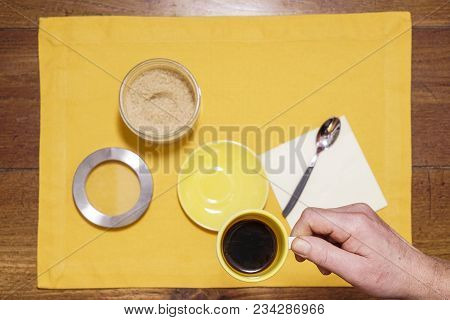 a cup of coffee on the wooden table