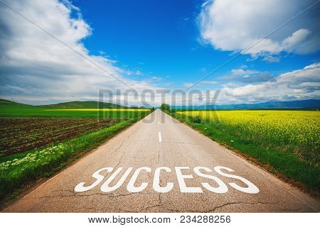 Driving On An Empty Asphalt Road Near Agricultural Fields At Beautiful Sunny Day. Concept For Succes
