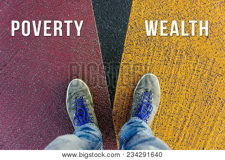 Divide Between Rich And Poor Symbolized By Two Feet Standing On Two Different Colors On Pathway From