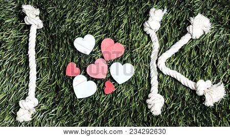 I Love K Rope Text Layed On Green Grass Surface