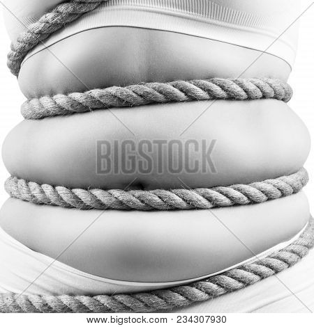 Fat Woman In White Underwear Twisted With A Rope. Obesity Concept. Over White Background.