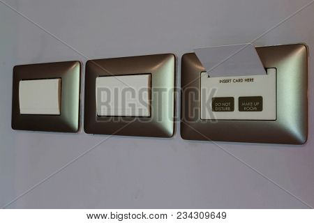 White Keycard Inserting Into Pocket In Hotel Room For Security