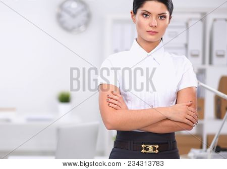 Attractive Businesswoman With Her Arms Crossed Stnding