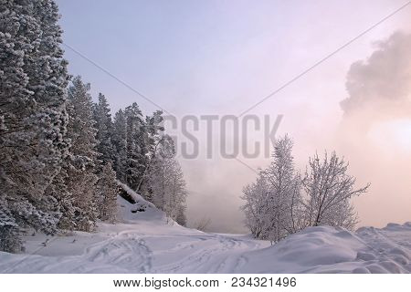 Amazing Winter Landscape Of The Snow Road Lead Into The Frozen Fog
