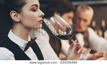 Experienced Sommelier Woman Explores Taste Of Wine In Restaurant. Wine Tasting. Checking Taste, Colo