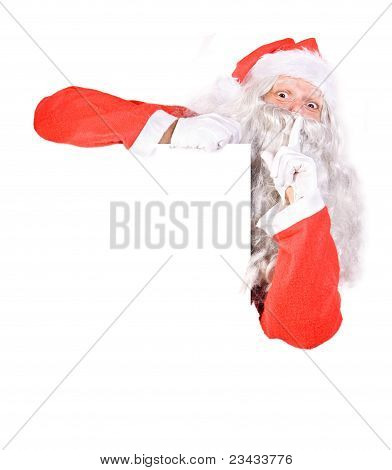 Santa Claus holding a blank sign