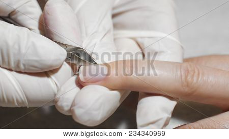 Cosmetologist Making Preparations For Manicure. Woman Getting Nail Manicure. Prepare Female Nails Fo