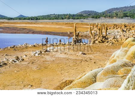 Gossan Reservoir With Orange Stalagmites On Shore, Andalusia, Spain