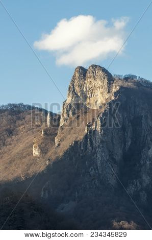 Mountain Slope In The Caucasus Mountains. Trees Without Leaves