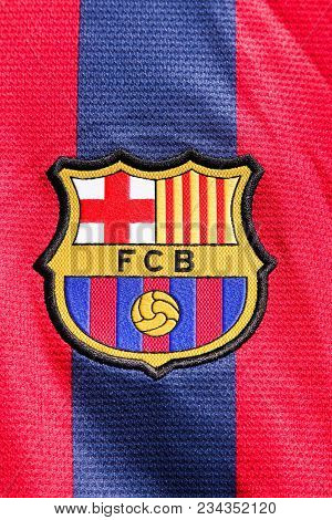 Odder, Denmark - March 26, 2018: Logo of FC Barcelona on a shirt. FC Barcelona is a professional football club based in Barcelona, Catalonia, Spain