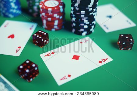 3d Illustration Playing Chips, Cards And Money For Casino Game On Green Table. Real Or Online Casino