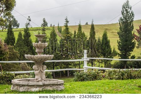 Fountain In A Garden With A View Across The Hills In The Andes Mountains Of Northern Ecuador
