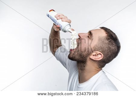 He Likes Sweet Food Among Everything In A World. This Man Is Putting Some Cream Into His Mouth With 