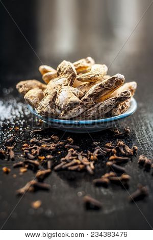 Close Up Of Ayurvedic Herb Or Folk Medicine Dried Ginger Or Zingiber Officinale With Black Pepper Co