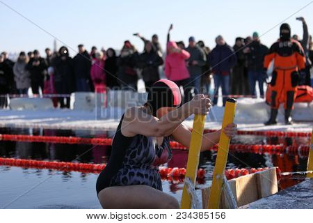 ST. PETERSBURG, RUSSIA - MARCH 4, 2018: Winter swimming competitions for Big Neva Cup. Winter swimmers from 12 countries aged from 12 to 78 take part in the competitions this year