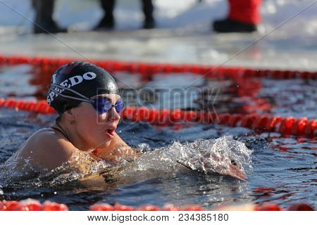 ST. PETERSBURG, RUSSIA - MARCH 4, 2018: Winter swimming competitions for Big Neva Cup. Winter swimmers from 12 countries aged from 12 to 78 take part in the competitions this year