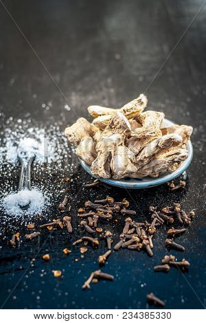 Close Up Of Ayurvedic Herb Or Folk Medicine Dried Ginger Or Zingiber Officinale With Black Pepper Co