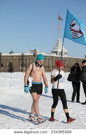ST. PETERSBURG, RUSSIA - MARCH 4, 2018:  Representatives of club Winter Swimmers of Capital City during winter swimming competitions for Big Neva Cup. Winter swimmers from 12 countries participate