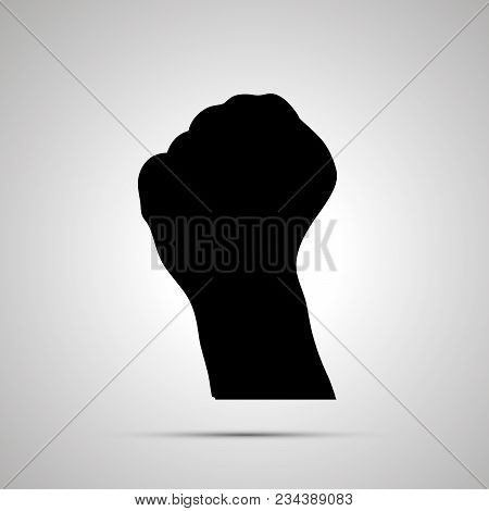 Black Silhouette Of Hand In Fist Gesture Isolated On White
