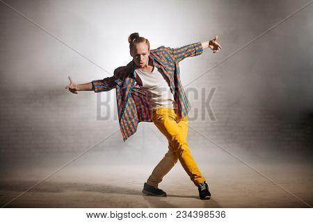 Stylish Handsome Man Doing Dancing Steps On The Street. Free Style. Being Mad Of Rap