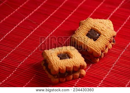 Chocolate Cookies On Gray Plate On Red Table
