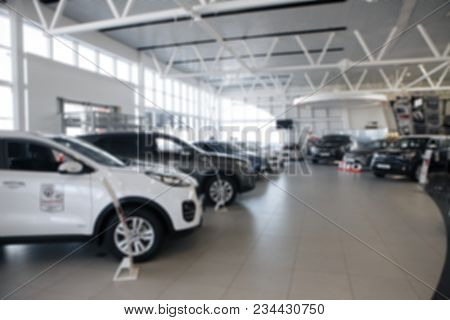 Auto Showroom, Dealer Talking With Buyer. Electro Cars In Moderm Vehicle