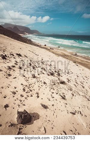 Praia Grande. Spectacular Sand Dunes, Ocean Waves And Black Volcanic Stones. Barren Landscape Of Cal