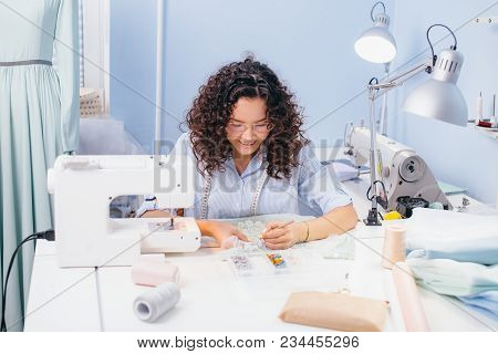 Tailor Embroidering At The Table On Workshop. Creative Work. Making Lace