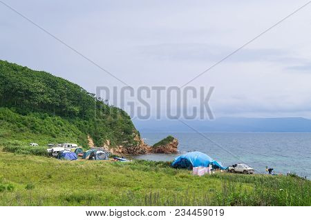 A Tourist Camp On The Shore Of The Picturesque Bay Of Putyatin Island In Primorsky Krai. People Rest