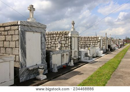Cloudy Sky Over Gravestones At The Old Lafayette Cemetery, Established In 1833 In The New Orleans, L