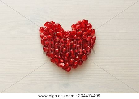 Red Heart Of Grenades. Big Ripe Red Granets Or Garnets. Fruits Of Red Ripe Pomegranate On The White 
