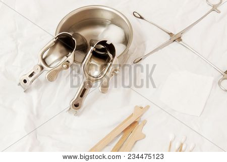 Vaginal Speculum Sterilized In Alcohol On Medical Instruments Table. Cervical Screening.