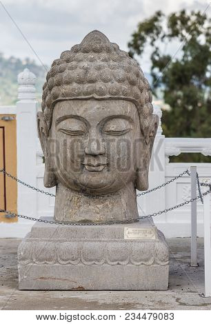 Hacienda Heights, Ca, Usa - March 23, 2018:  Closeup Of Teh Buddha Head Stone Statue At Entrance Gat