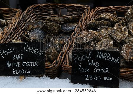 A Selection Of Oysters On Display At A Fishmonger In A London Food Market.