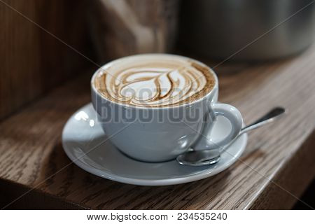 Coffee Served From An Artisan Café With An Artistic Topping.